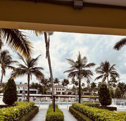 a view of a resort with palm trees at ROYAL COLONIAL in Boca Raton