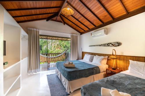 Ένα ή περισσότερα κρεβάτια σε δωμάτιο στο Sup House Barra Grande