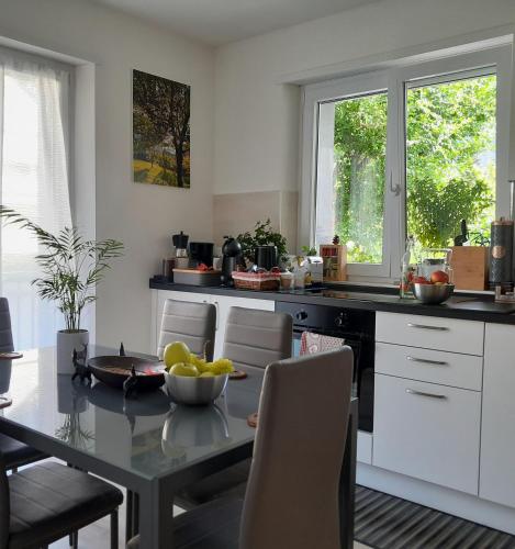 a kitchen with a table with a bowl of fruit on it at Appartment Lodged Mamma Maria in Mattarello