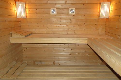 an inside of a sauna with wood paneling at Gîte 1805Bis Montagnes du Jura avec Spa et Sauna classé 3 étoiles in Foncine-le-Haut