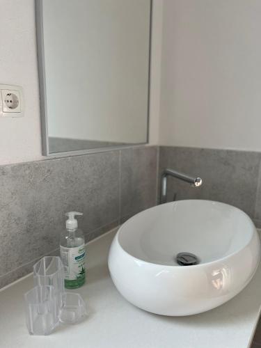 a white sink sitting on a counter in a bathroom at Four Points in Vir