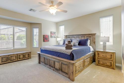 a bedroom with a bed and a ceiling fan at Resort Amenities and Patio at 55 and Goodyear Escape! in Goodyear