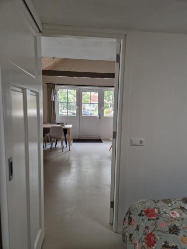 a view of a living room with a dining room at Fenix Edam in Edam