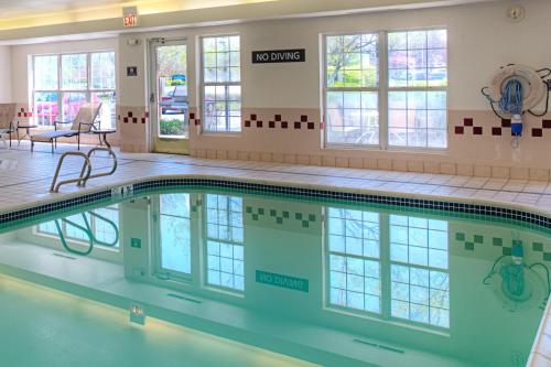 a swimming pool in a hospital building with a waiting room at Residence Inn Portland Scarborough in Scarborough