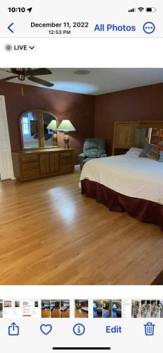 a picture of a bedroom with a bed and a mirror at Shared Awesome Villa in Melbourne