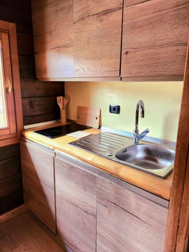 a kitchen with a sink and a counter at Campaegli resort in Campaegli