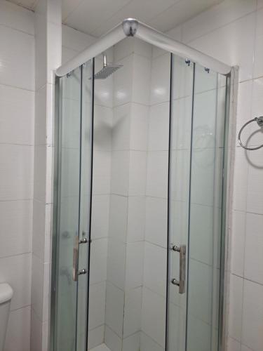 a shower with a glass door in a bathroom at centrico pb "A" in Resistencia