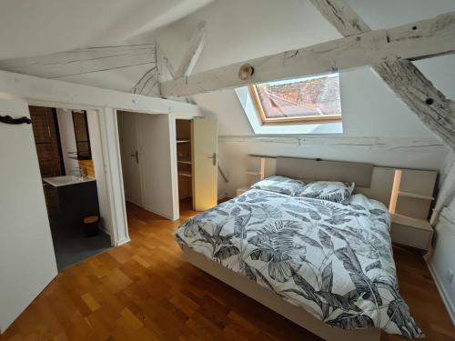 Кровать или кровати в номере Le nid de l'île