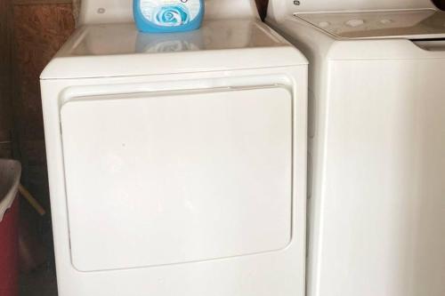 a white refrigerator with a bottle on top of it at Amazing Sunsets bay view @The Villa at Copano Cove in Rockport