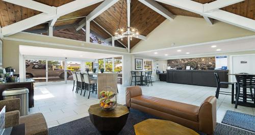 a living room with a couch and a table at Best Western Gold Country Inn in Grass Valley