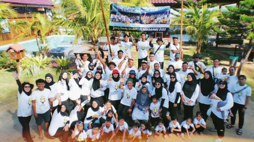 a large group of people posing for a picture at Bayu Beach Penarek in Penarek