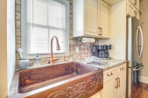 a kitchen with a large wooden kitchen sink at Cozy Savannah Vacation Rental with Fenced Courtyard! in Savannah