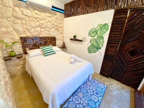 a bedroom with a bed in a room at Xcabal Hotel boutique in Bacalar