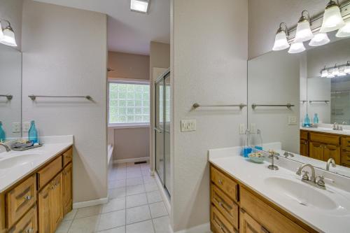 a bathroom with two sinks and a shower at Hot Springs Village Home with Golf Course View in Hot Springs Village