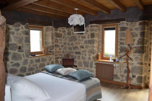 Postel nebo postele na pokoji v ubytování Casa Maru