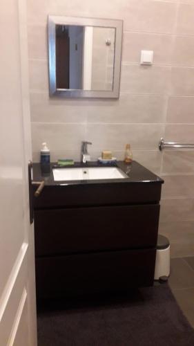 a bathroom with a sink and a mirror at Sintra lousa in Sintra