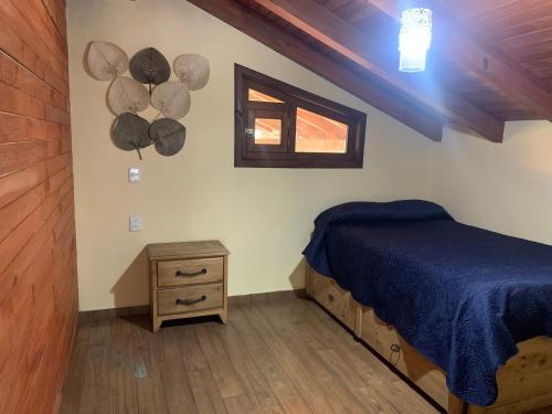 Ein Bett oder Betten in einem Zimmer der Unterkunft Cabañas Las Morenas Mazamitla