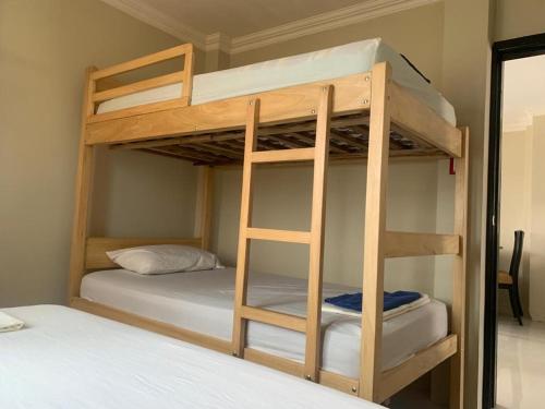 a bunk bed with two bunk beds in a room at Punta Blanca 5.5, Dpto Vista al mar in Punta Blanca