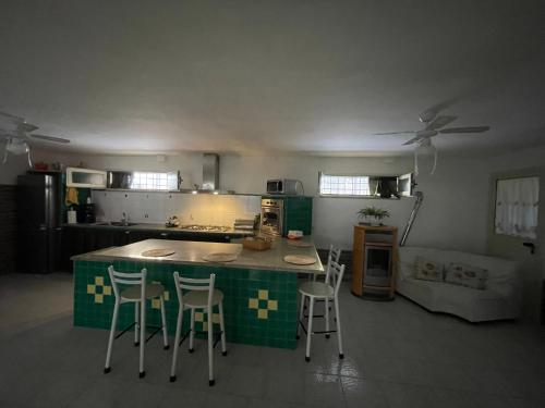 Kuchyň nebo kuchyňský kout v ubytování La Villa Carmela Cuma