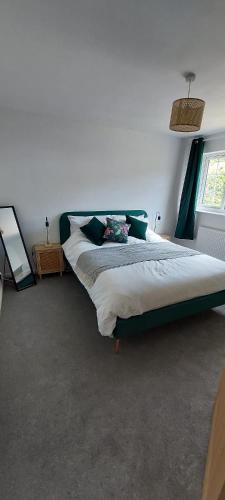 a bedroom with a large bed in a room at Modern Town House in Mid Wales in Knighton