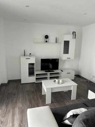 a living room with a couch and a coffee table at Piso Sardinero - Almar d'Pipe in Santander