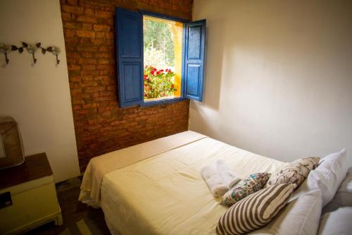 Postel nebo postele na pokoji v ubytování Vila ACONCHEGO AZUL 3