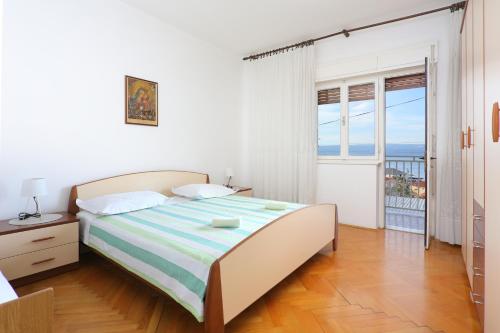 Postel nebo postele na pokoji v ubytování Apartments with a parking space Sumpetar, Omis - 950