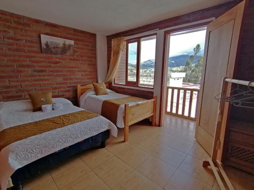 Postel nebo postele na pokoji v ubytování Lagoon Hotel Chugchilan