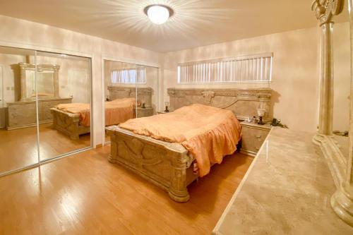 a large bedroom with two beds and a mirror at Clearlake Charmer in Clearlake Oaks
