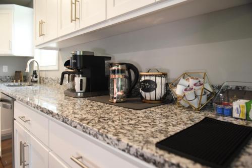 a kitchen counter with a coffee maker on it at Bluegrass & Bourbon - a Peaceful Retreat & Hangout in Bardstown
