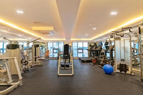 a gym with several treadmills and machines at Pohang A1Hotel Haedo in Pohang