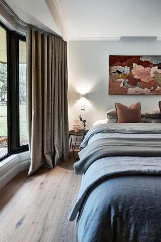 Ένα ή περισσότερα κρεβάτια σε δωμάτιο στο Leonards Hill House - Daylesford Region