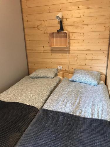 מיטה או מיטות בחדר ב-Bieszczadzki Luz