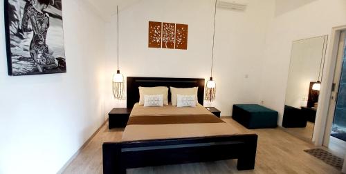 a bedroom with two beds in a room at Villa Oceana I - 3BR private villa with pool in Legian