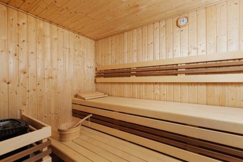 a sauna with two beds in a wooden room at Holiday House Adam in Prosečné