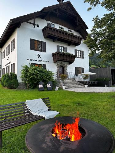 a fire pit in front of a building at NEUHOFGUT I exklusiv und privat! in Radstadt