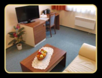 a room with a table with a bowl of fruit on it at Rekreačné zariadenie Crocus in Vysoké Tatry