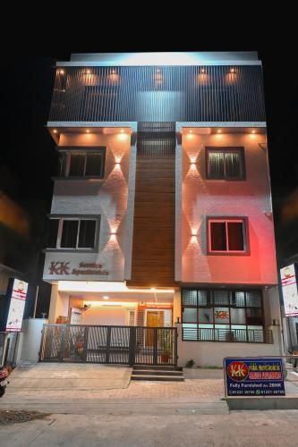 a tall building with lights on the side of it at KK SERVICE APARTMENTS in Vellore