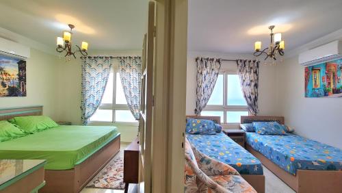 um quarto com 2 camas e 2 janelas em Miami Island em Alexandria