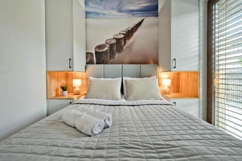 Ένα ή περισσότερα κρεβάτια σε δωμάτιο στο Apartamenty In Belnihel