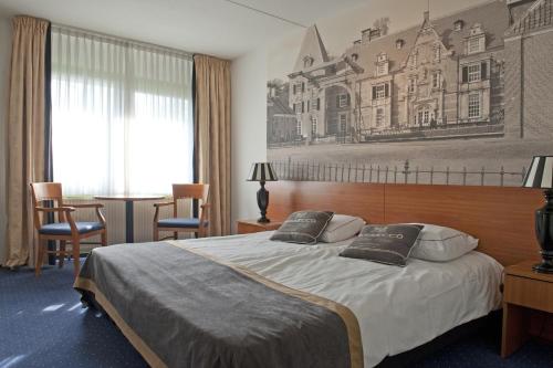 Een bed of bedden in een kamer bij Hotel Wapen van Delden