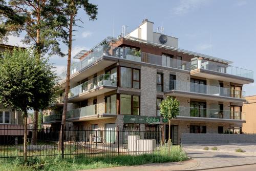 an apartment building with balconies on the side of it at ApartamentyIn Belnihel in Hel