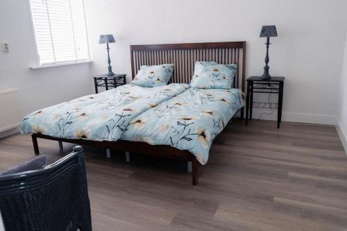 Ένα ή περισσότερα κρεβάτια σε δωμάτιο στο Vakantiebungalow Limmen