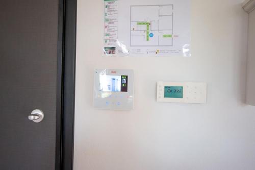 a white refrigerator with a diagram on the side of it at Apartmani Kac in Karlovac