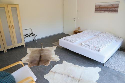 Postel nebo postele na pokoji v ubytování Plantagengut Hosterwitz