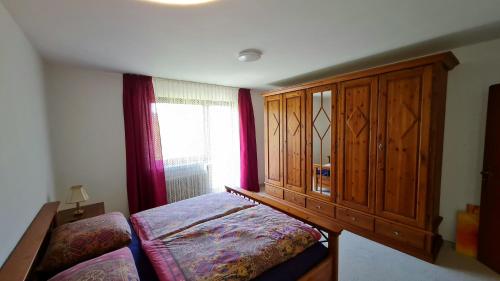 A bed or beds in a room at Ferienwohnungen Nohner Mühle