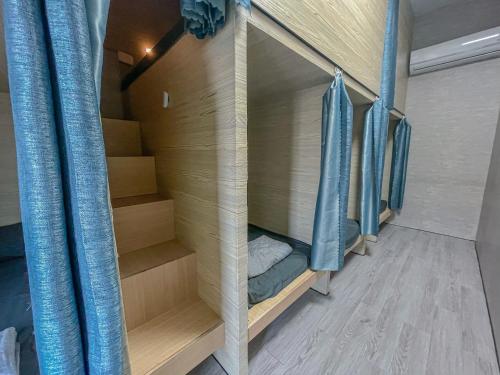 Postel nebo postele na pokoji v ubytování O2潛水俱樂部