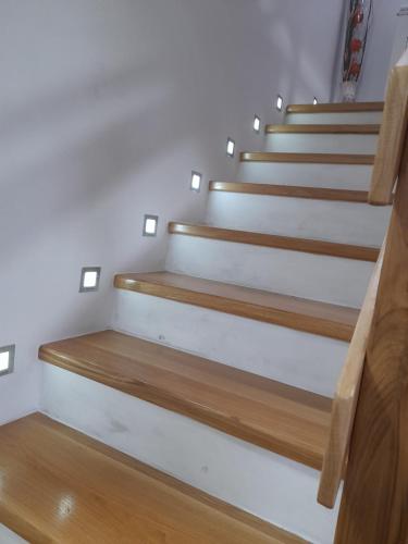 a set of stairs in a room with wood at Villa Usivak for green quiet holiday near Sarajevo#TravellerAwards2025 in Sarajevo