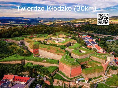 an aerial view of a castle in the mountains at Willa Sowia nowe apartamenty nad górskim potokiem zachwycający widok na góry in Stronie Śląskie