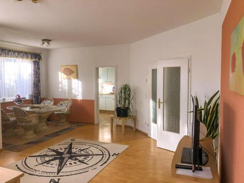 a large living room with a table and a room with at Ferienwohnung im Kranichgebiet in Groß Mohrdorf